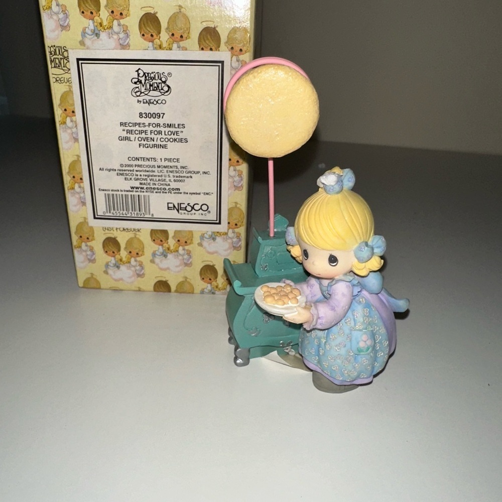 Precious Moments Blue and Yellow Figurine